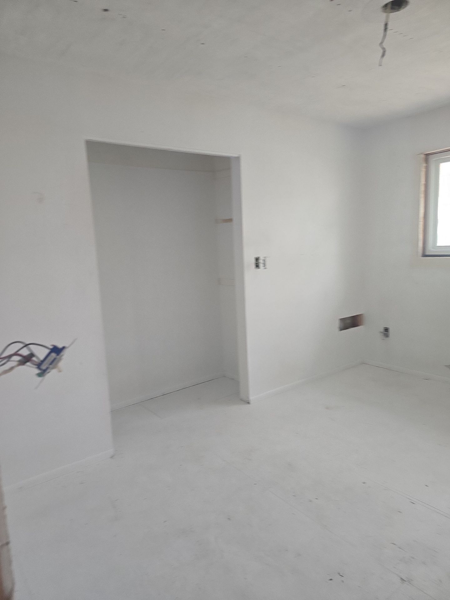 Residential interior finish work with newly finished walls