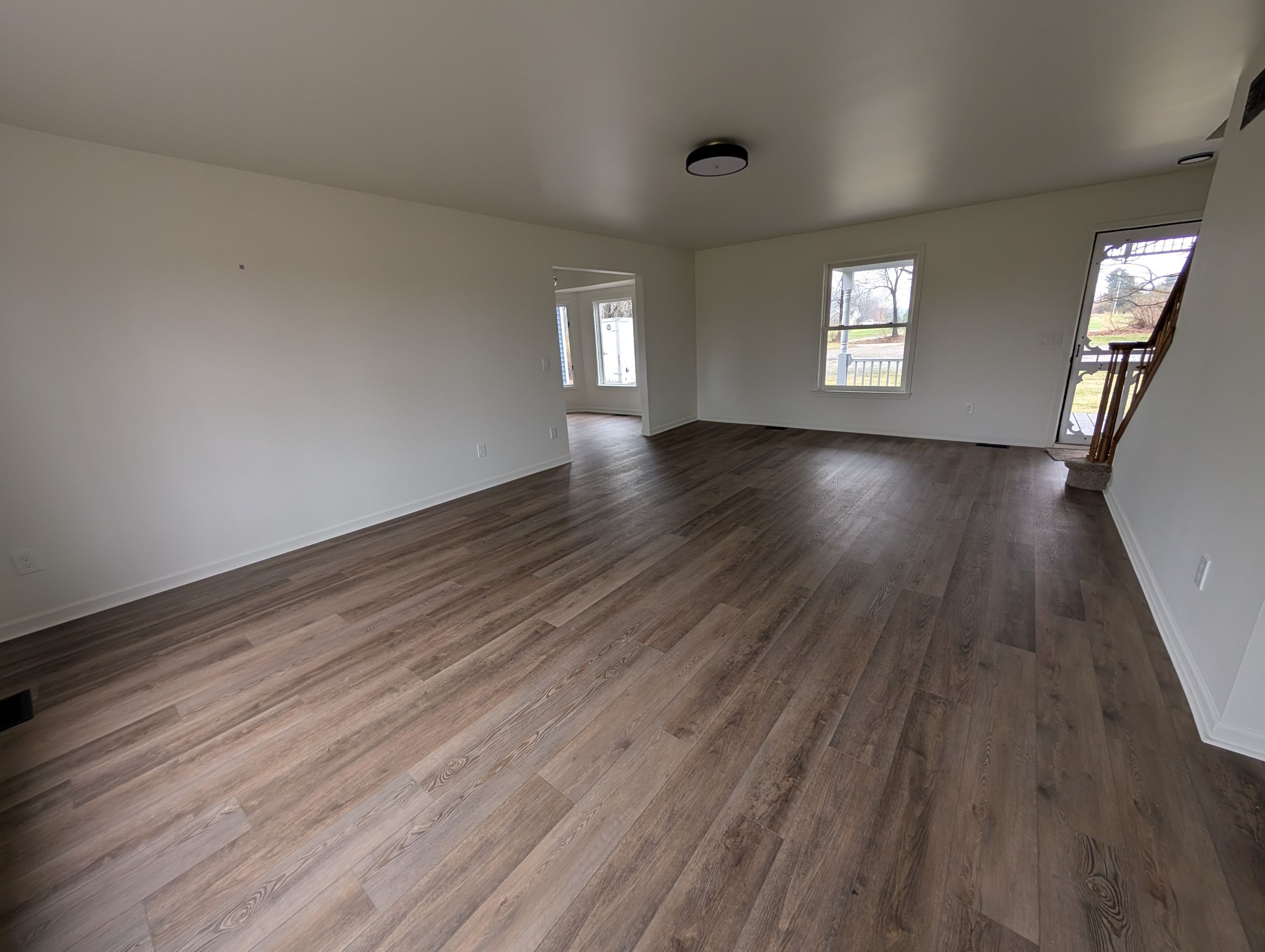 Residential living area after rehabilitation with updated flooring and finishes